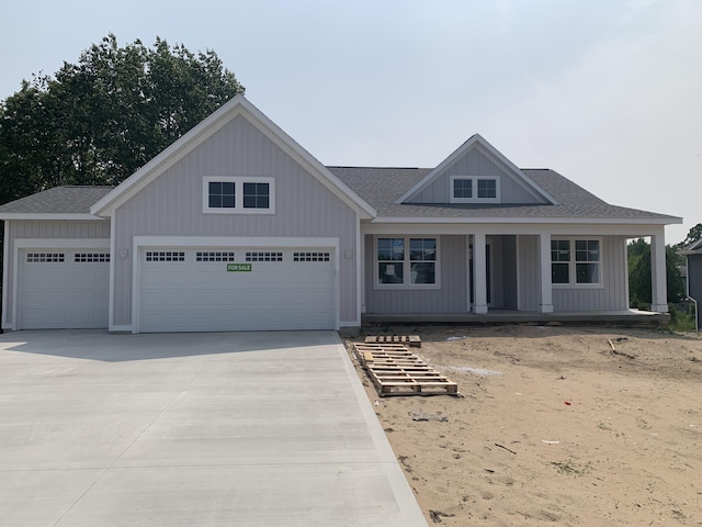 3094 Timberpine Ave, Holland, MI 49424 - view of front of property with driveway, an attached garage, a shingled roof, and a porch