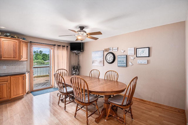 13278 W Stanton Rd, Trufant, MI 49347 - dining space featuring ceiling fan and light wood-style flooring