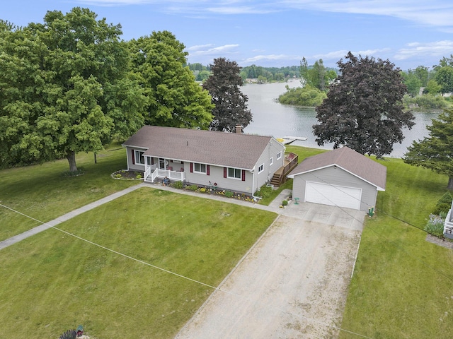 13278 W Stanton Rd, Trufant, MI 49347 - view of front facade with a water view, a porch, roof with shingles, a garage, and an outbuilding