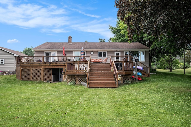 13278 W Stanton Rd, Trufant, MI 49347 - rear view of property featuring a wooden deck, a lawn, stairway, and a chimney