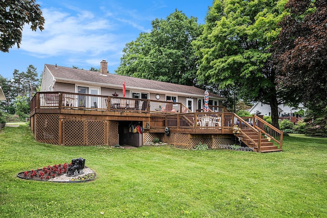 13278 W Stanton Rd, Trufant, MI 49347 - back of house featuring a chimney, a deck, and a lawn