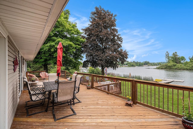 13278 W Stanton Rd, Trufant, MI 49347 - deck with a water view, outdoor dining space, and a yard