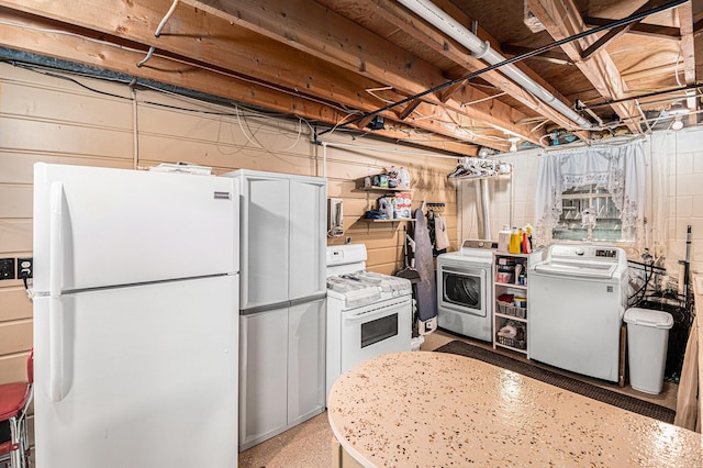 13278 W Stanton Rd, Trufant, MI 49347 - kitchen with white appliances and washing machine and dryer