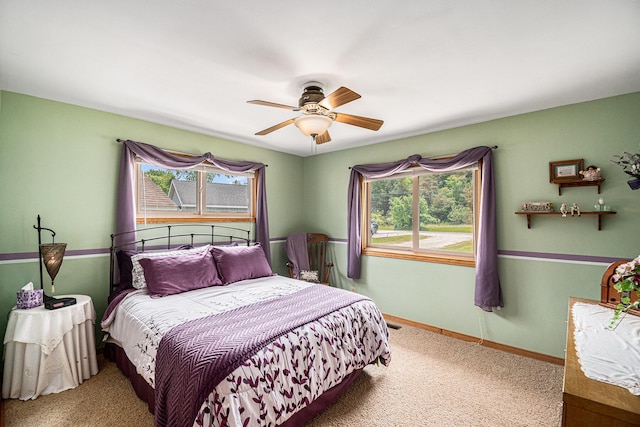 13278 W Stanton Rd, Trufant, MI 49347 - carpeted bedroom with multiple windows and a ceiling fan