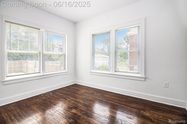 2701 Tuxedo St, Detroit, MI 48206 - empty room featuring healthy amount of natural light and dark wood finished floors