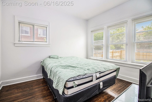 2701 Tuxedo St, Detroit, MI 48206 - bedroom featuring dark wood-style flooring and multiple windows