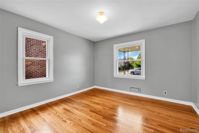 13513 Chestnut St, Southgate, MI 48195 - empty room with light wood-style floors and baseboards