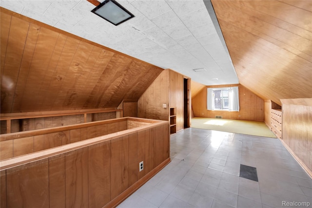 13513 Chestnut St, Southgate, MI 48195 - additional living space featuring vaulted ceiling, wooden walls, and built in shelves