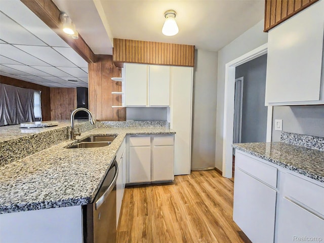 13513 Chestnut St, Southgate, MI 48195 - kitchen featuring dishwasher, open shelves, light wood-type flooring, and light stone counters