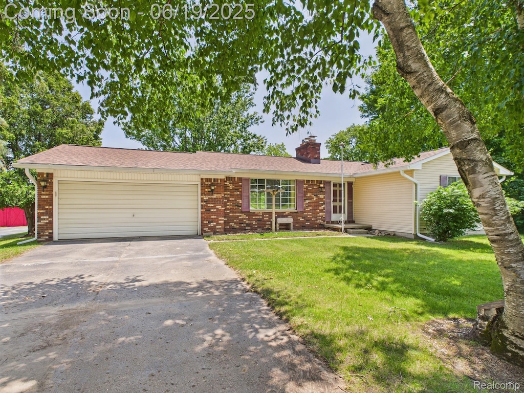 10277 S State Rd, Goodrich, MI 48438 - ranch-style house with driveway, brick siding, a chimney, a garage, and a front lawn