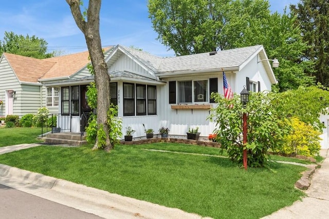 2885 Bluff St, Stevensville, MI 49127 - ranch-style home with a front yard, board and batten siding, and roof with shingles