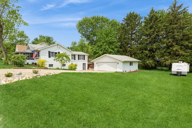 2885 Bluff St, Stevensville, MI 49127 - view of green lawn with a detached garage and an outdoor structure