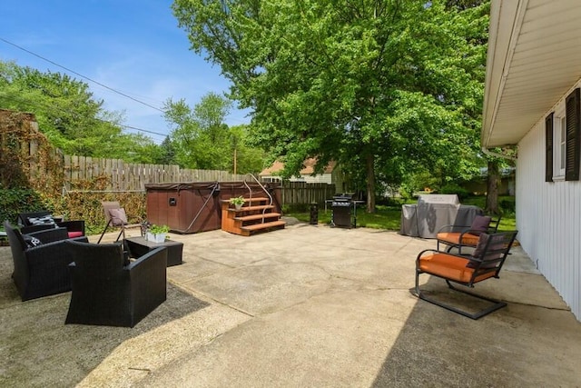 2885 Bluff St, Stevensville, MI 49127 - fenced backyard featuring a hot tub, a patio area, and a grill