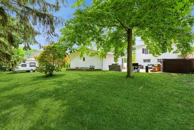 2885 Bluff St, Stevensville, MI 49127 - view of green lawn with a hot tub and a patio area
