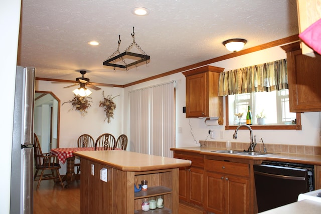 143 Tree Stand Rd, Rose City, MI 48654 - kitchen with black dishwasher, freestanding refrigerator, a ceiling fan, brown cabinetry, and a center island