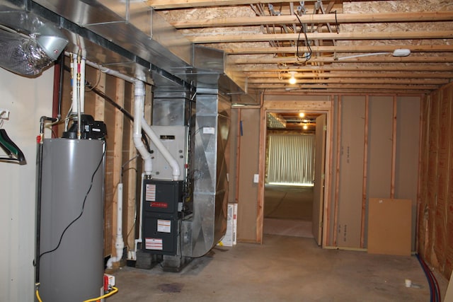 143 Tree Stand Rd, Rose City, MI 48654 - unfinished below grade area featuring water heater and heating unit