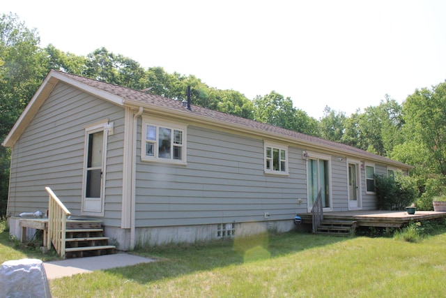 143 Tree Stand Rd, Rose City, MI 48654 - rear view of property with a wooden deck and a lawn