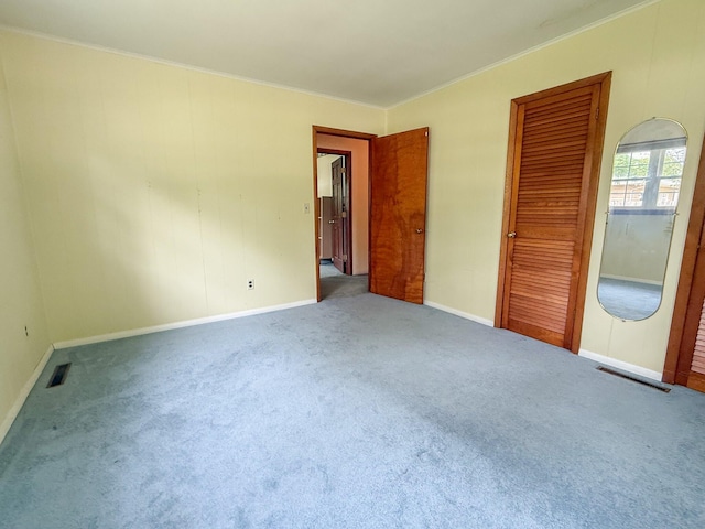 92359 Center St, Dowagiac, MI 49047 - unfurnished bedroom featuring carpet floors, a closet, and crown molding