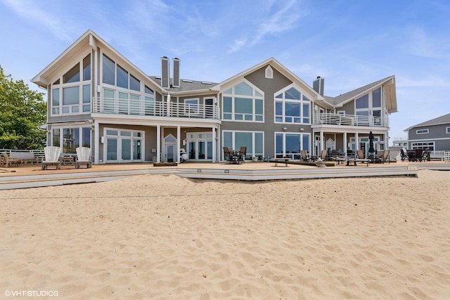 400 Lake Dr Unit C, New Buffalo, MI 49117 - back of house featuring a chimney, a patio area, a balcony, and french doors