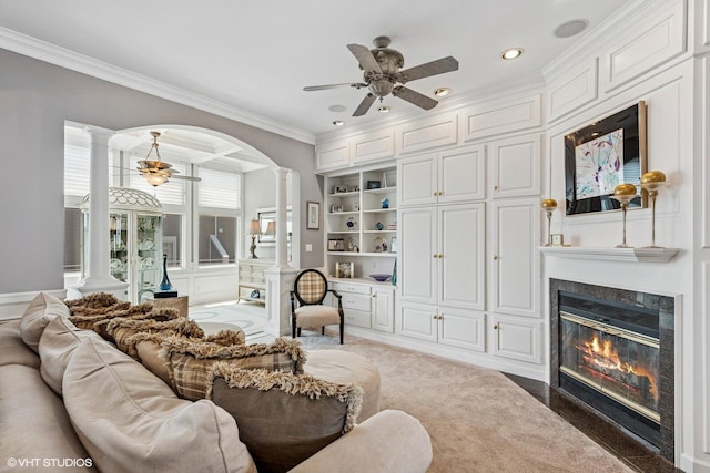 400 Lake Dr Unit C, New Buffalo, MI 49117 - carpeted living room with ornate columns, a ceiling fan, crown molding, a fireplace, and recessed lighting