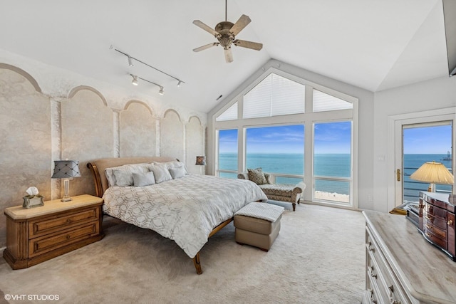 400 Lake Dr Unit C, New Buffalo, MI 49117 - carpeted bedroom with access to exterior, vaulted ceiling, a water view, and ceiling fan