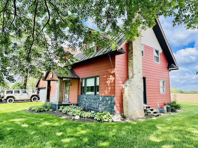 4691 2nd St, Caledonia, MI 49316 - view of property exterior featuring entry steps, a lawn, and stone siding