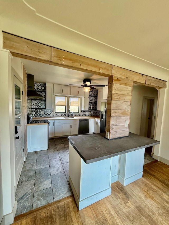 4691 2nd St, Caledonia, MI 49316 - kitchen with dishwasher, stainless steel fridge, dark countertops, and tasteful backsplash