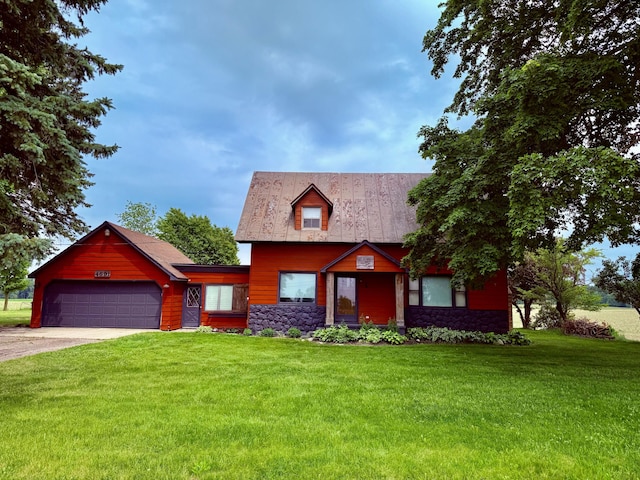 4691 2nd St, Caledonia, MI 49316 - view of front of house with a front yard, an attached garage, stone siding, and concrete driveway