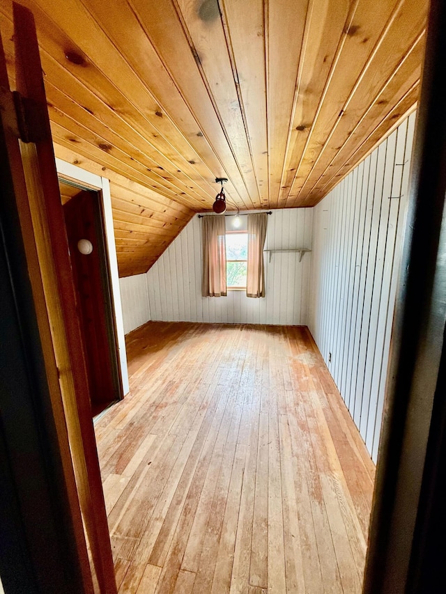 4691 2nd St, Caledonia, MI 49316 - bonus room featuring light wood-style floors, vaulted ceiling, wooden ceiling, and wood walls