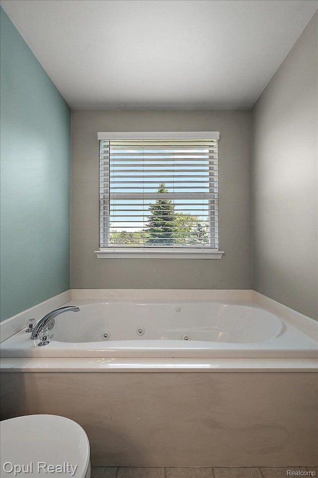 1978 Frances Way, Ypsilanti, MI 48198 - bathroom featuring a jetted tub and tile patterned flooring