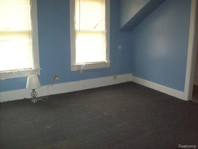 27 Clarence St, Pontiac, MI 48342 - bonus room featuring healthy amount of natural light and dark carpet