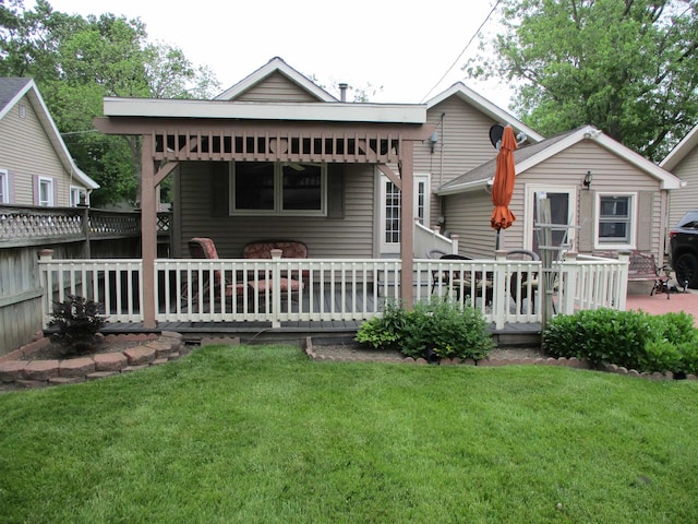 507 Mackinaw St, Durand, MI 48429 - rear view of property featuring a yard and a wooden deck