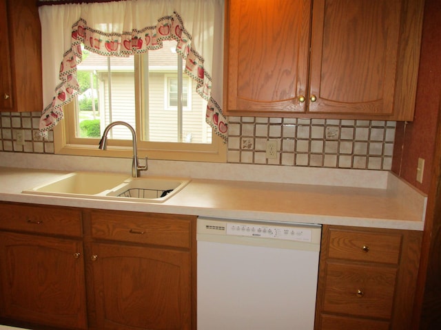 507 Mackinaw St, Durand, MI 48429 - kitchen with white dishwasher, light countertops, decorative backsplash, and brown cabinets