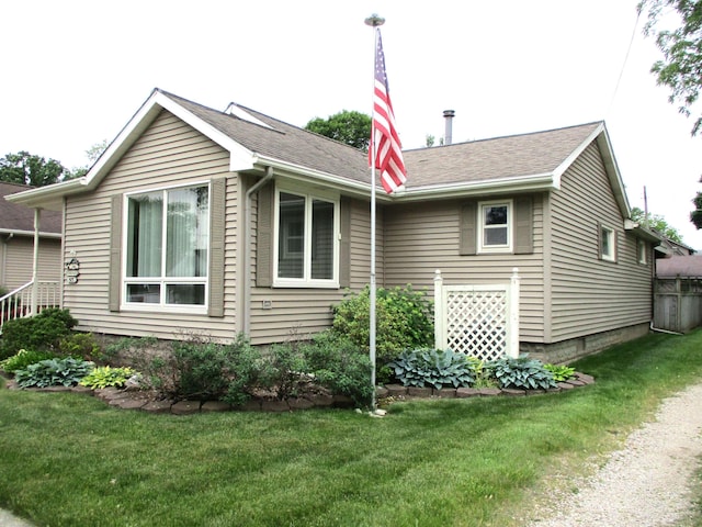507 Mackinaw St, Durand, MI 48429 - view of property exterior with a yard and roof with shingles