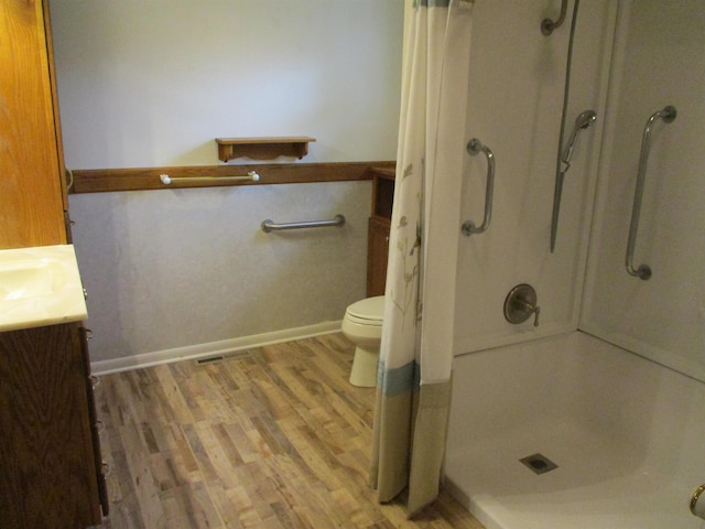 507 Mackinaw St, Durand, MI 48429 - full bath featuring a stall shower, vanity, and wood finished floors
