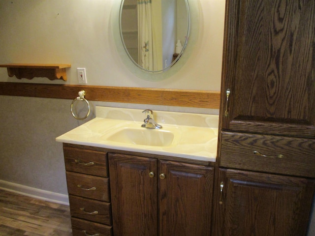 507 Mackinaw St, Durand, MI 48429 - bathroom with vanity and wood finished floors