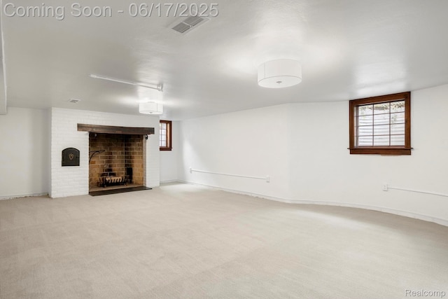 33 Oxford Blvd, Pleasant Ridge, MI 48069 - unfurnished living room featuring a fireplace, healthy amount of natural light, and light colored carpet