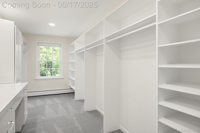 33 Oxford Blvd, Pleasant Ridge, MI 48069 - spacious closet with a baseboard heating unit and carpet floors