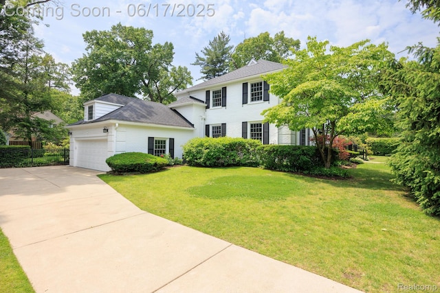 33 Oxford Blvd, Pleasant Ridge, MI 48069 - colonial home with driveway, a garage, brick siding, and a shingled roof