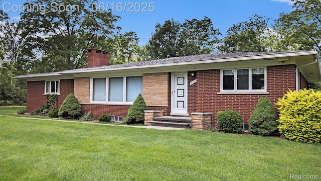 21556 Thorofare Rd, Trenton, MI 48138 - single story home with a chimney, brick siding, and a front yard