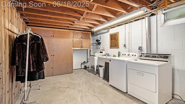 21556 Thorofare Rd, Trenton, MI 48138 - laundry room featuring washing machine and clothes dryer and concrete block wall