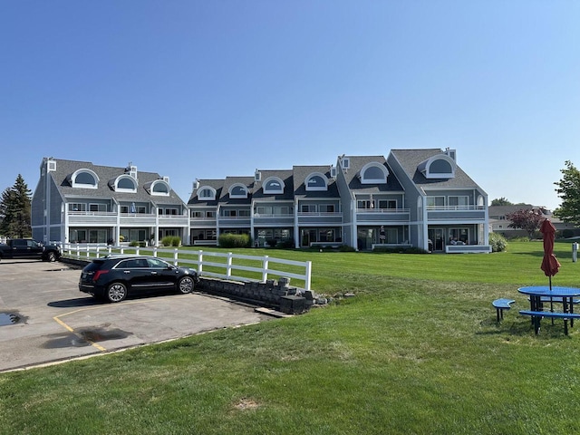 113 Millpoint Dr Unit 113, Spring Lake, MI 49456 - view of building exterior with uncovered parking