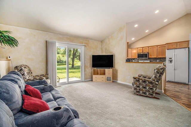 4497 Tiffany Ave, Portage, MI 49002 - living room featuring lofted ceiling, recessed lighting, carpet flooring, and wood finished floors