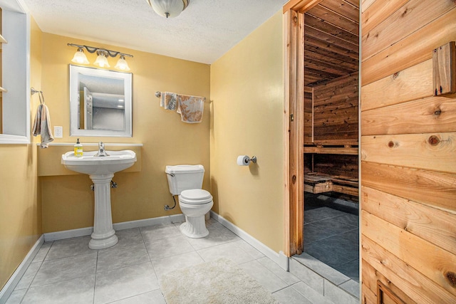 4497 Tiffany Ave, Portage, MI 49002 - half bath with tile patterned floors and a textured ceiling