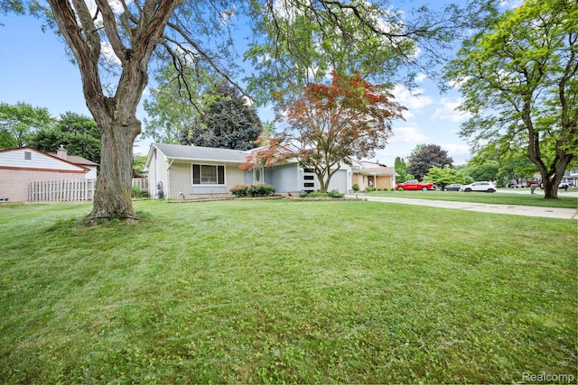 23870 Rockingham St, Southfield, MI 48033 - view of front of property featuring driveway, a garage, and brick siding