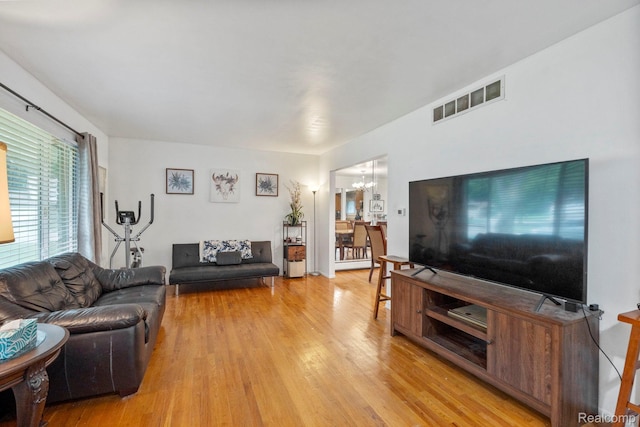 23870 Rockingham St, Southfield, MI 48033 - living room with light wood-style flooring and a chandelier