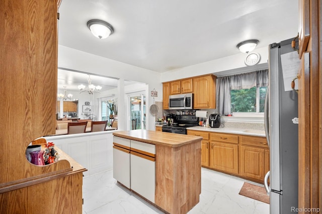 23870 Rockingham St, Southfield, MI 48033 - kitchen featuring stainless steel appliances, light marble finish flooring, a chandelier, and plenty of natural light