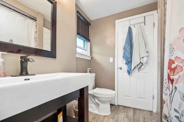 23870 Rockingham St, Southfield, MI 48033 - bathroom with wood finished floors, vanity, and a shower with curtain