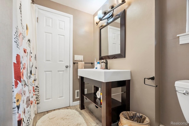 23870 Rockingham St, Southfield, MI 48033 - bathroom with wood finished floors and toilet
