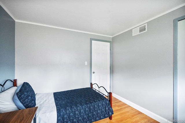 23870 Rockingham St, Southfield, MI 48033 - bedroom featuring ornamental molding and wood finished floors